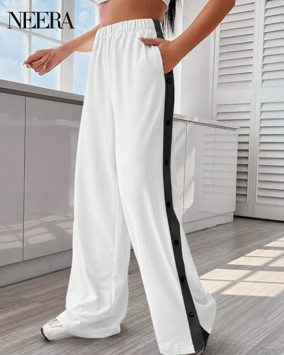 Trousers with side buttons and stripes